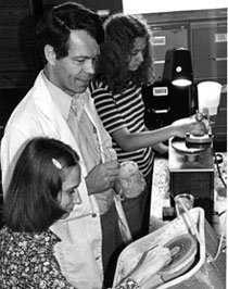 Image of dr-max-reams-w-students-polishing-rocks-ca-1980s